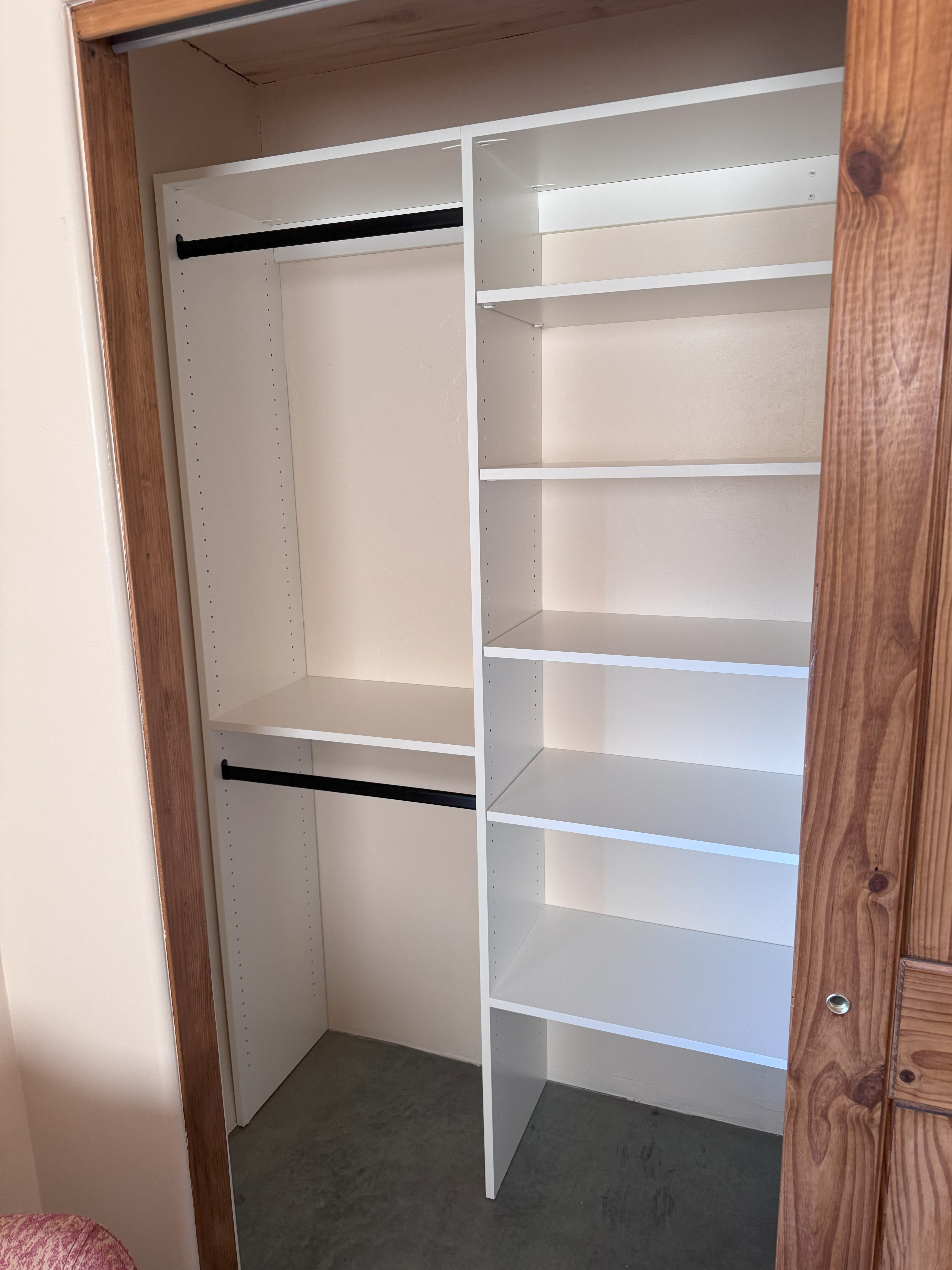 Custom Closet System with Black Hanging Rods